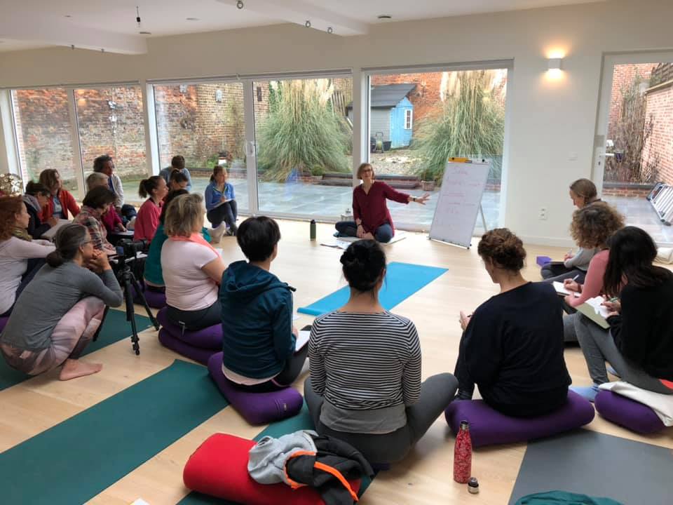 Students and teacher sitting